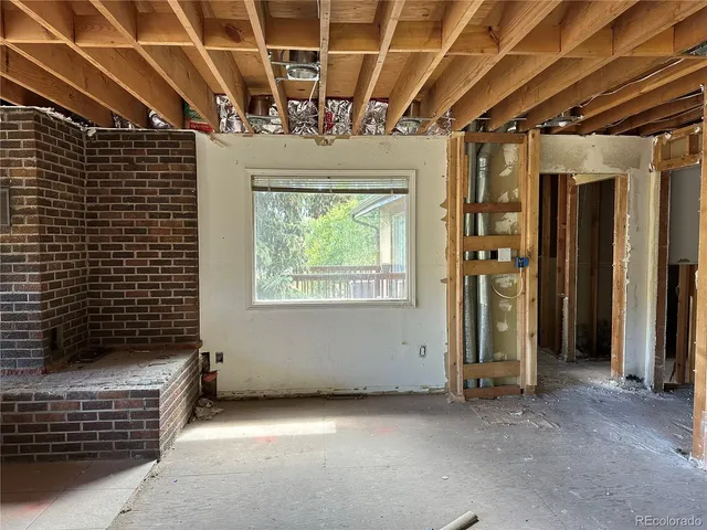 a view of an empty room with a windows