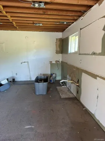 a room with a table and chairs