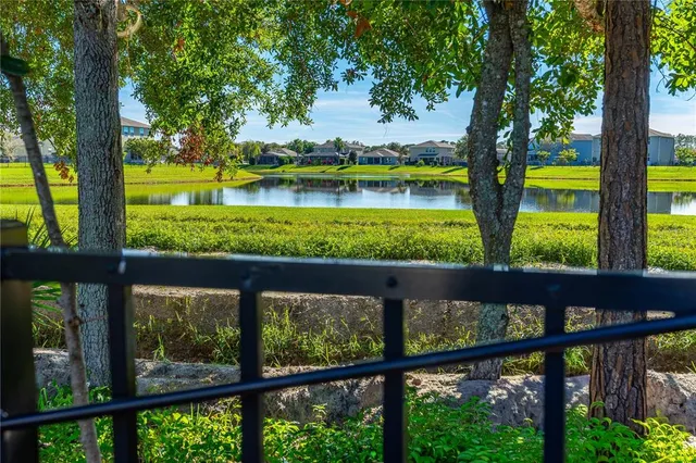 a house view with swimming pool and garden space