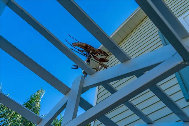 a view of a living room with furniture and wooden floor