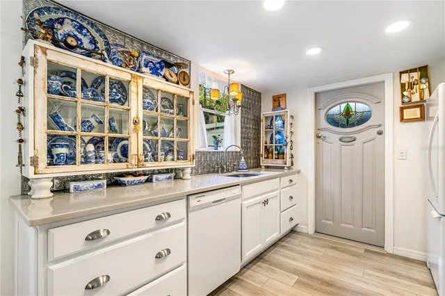 a kitchen with stainless steel appliances a stove a refrigerator and a microwave