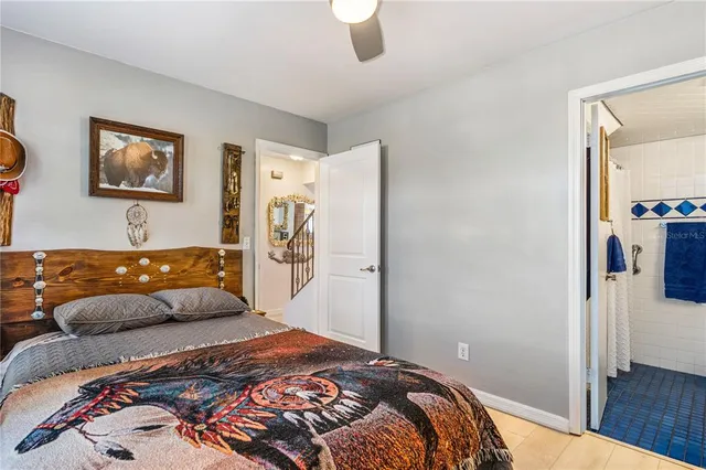 a bathroom with a sink a toilet and a shower curtain