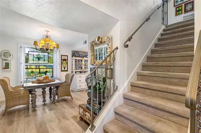 a view of staircase with wooden floor