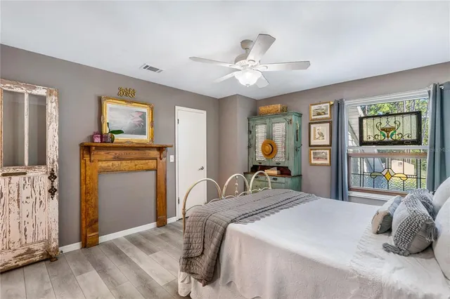 a view of a bedroom with bed and tv
