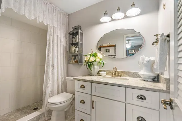 a view of a living room with furniture and a window
