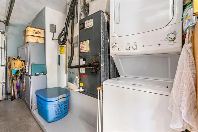 a view of a backyard with plants and a patio