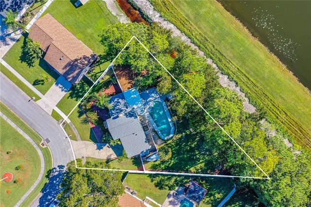 an aerial view of a houses and an outdoor space