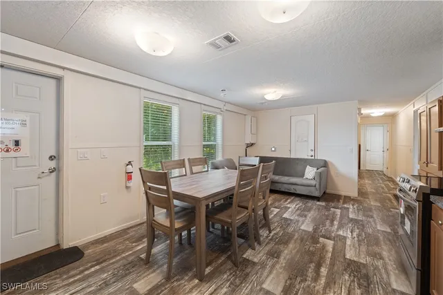 a view of a room with furniture window and wooden floor