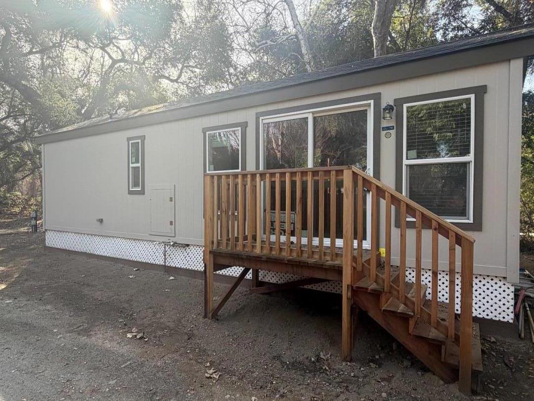 18842 Cachagua Road Carmel Valley, CA 93924 - Photo 11 of 35 a view of a wooden deck and a yard