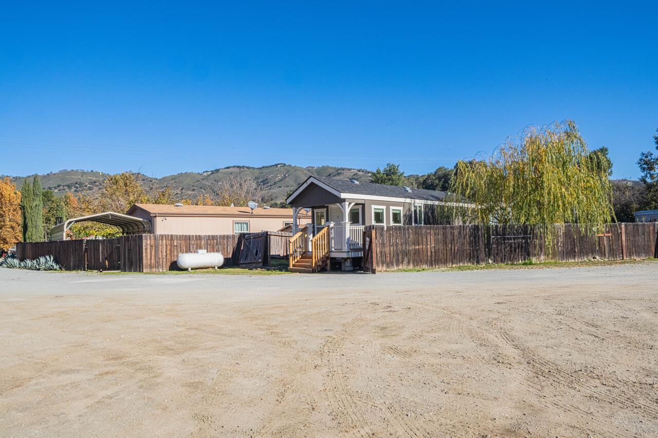 18842 Cachagua Road Carmel Valley, CA 93924 - Photo 15 of 35 a view of a house with a yard and a large tree