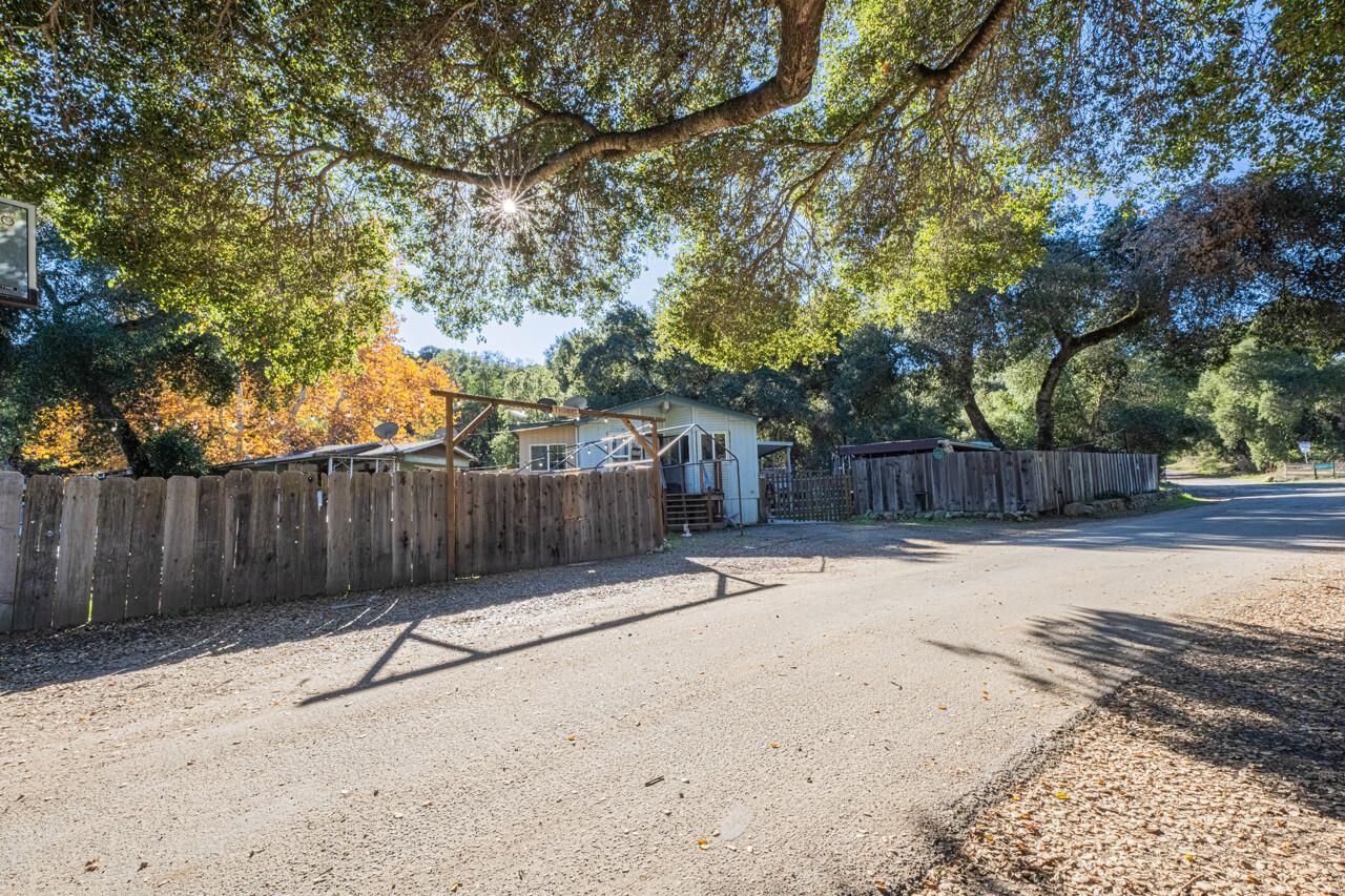 18842 Cachagua Road Carmel Valley, CA 93924 - Photo 31 of 35 a street view with wooden fence