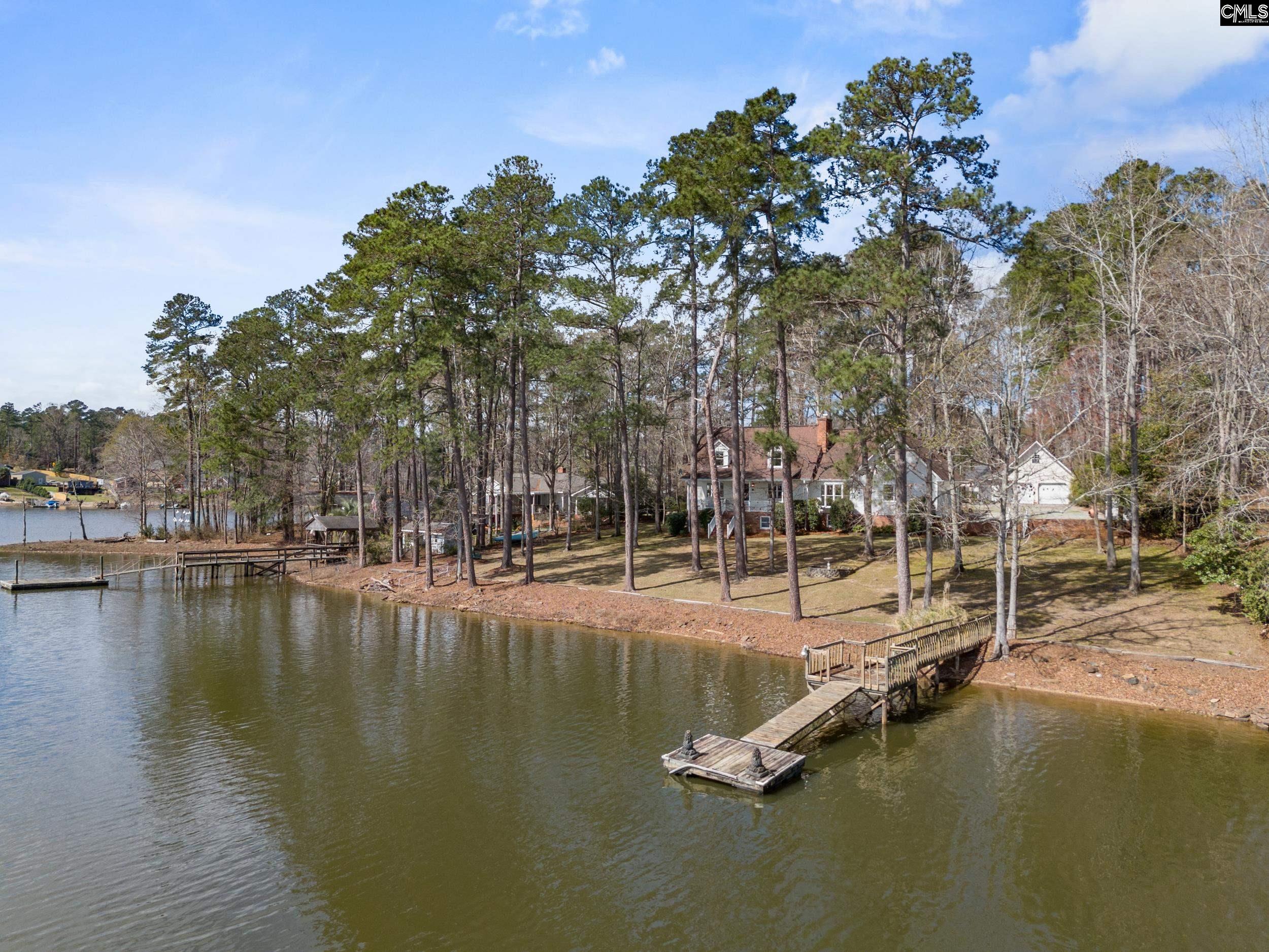 115 Rocky Ridge Road Leesville, SC 29070 - Photo 45 of 51 a view of a lake with trees
