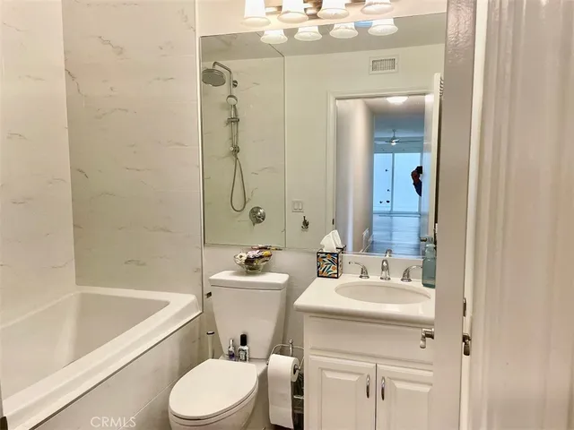 a bathroom with a sink a toilet and a bathtub