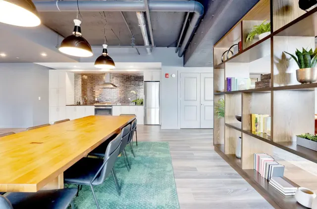 a room with wooden floor and windows