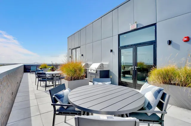 a dinning table and chairs in a patio