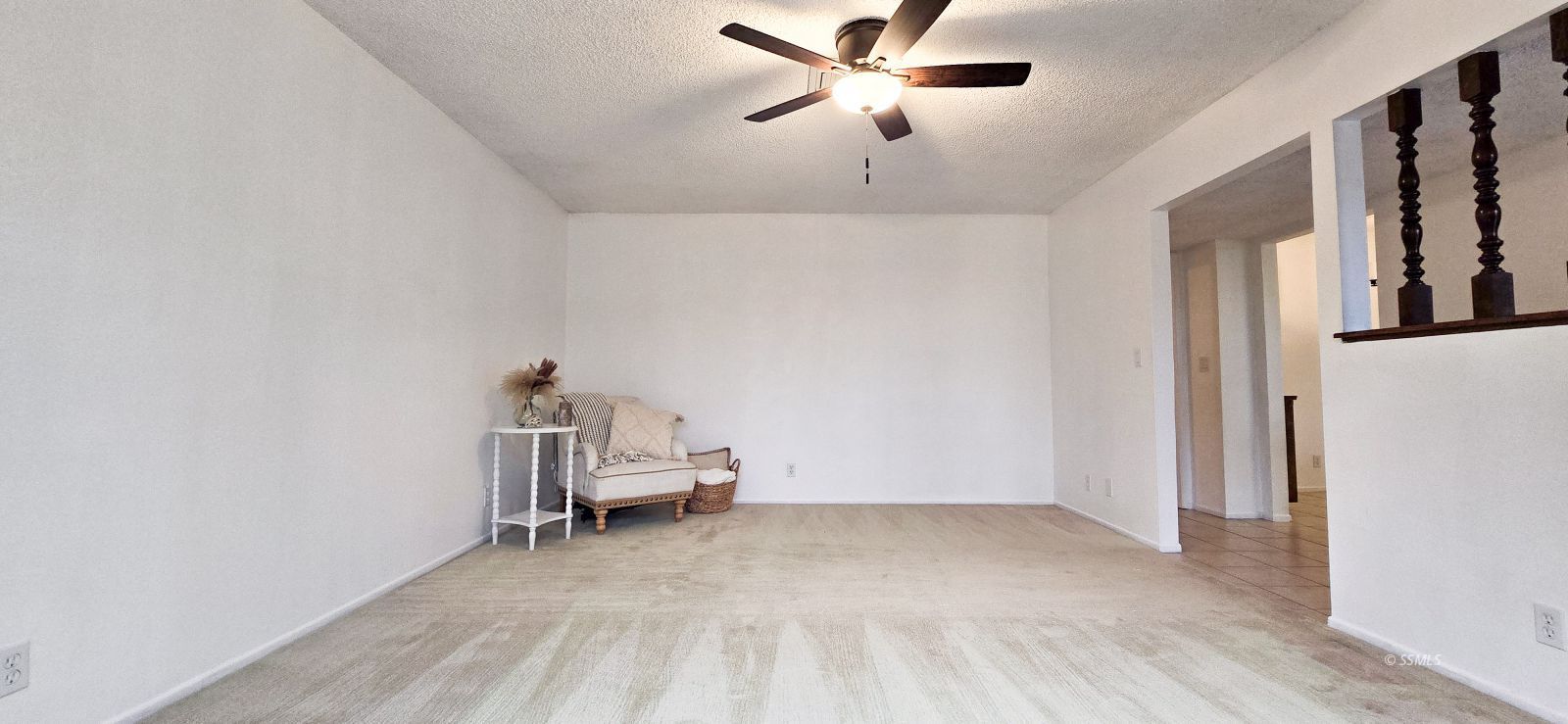 441 Cheyenne Circle Ridgecrest, CA 93555 - Photo 8 of 34 a view of a livingroom with lounge chair and ceiling fan