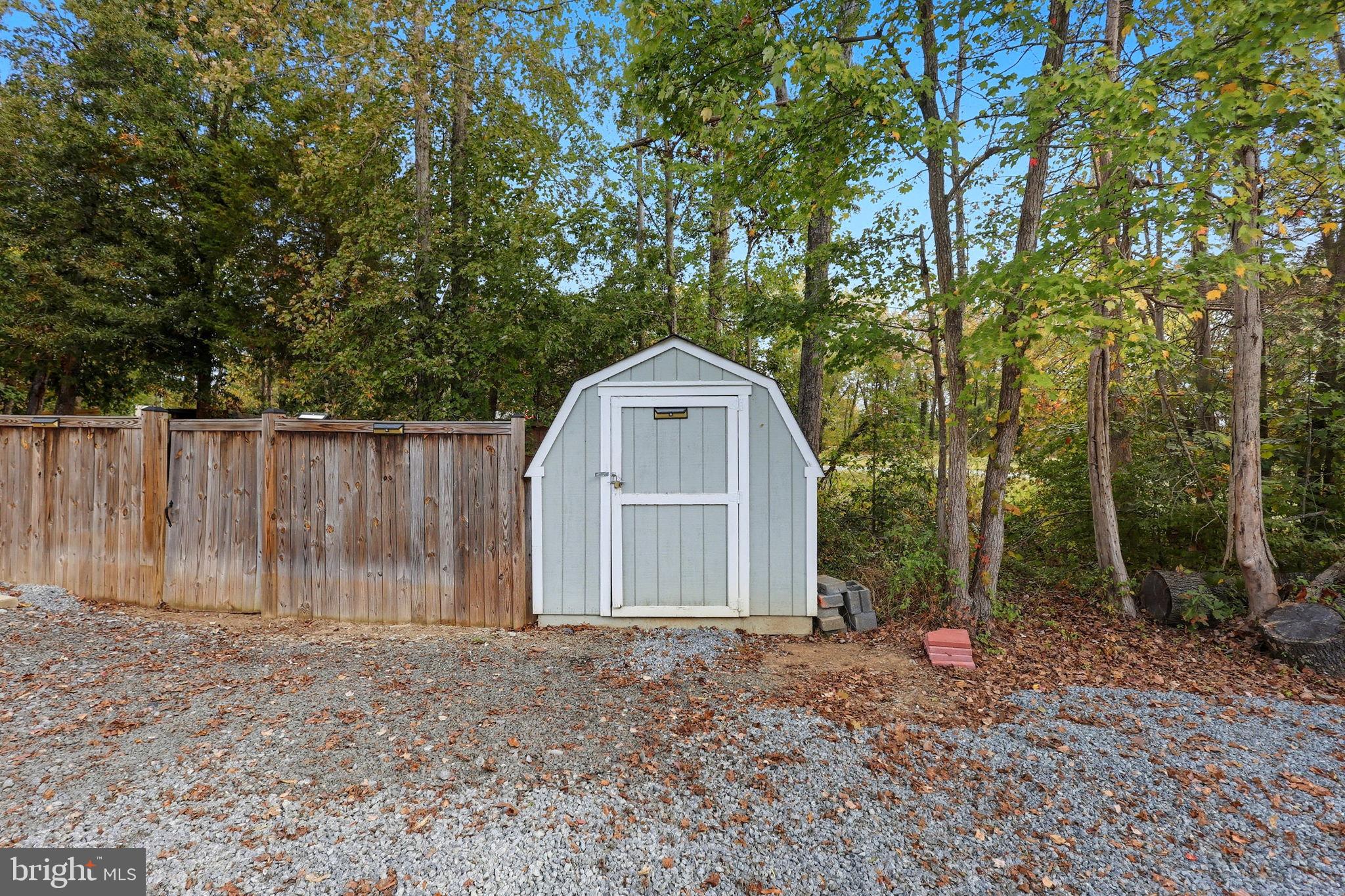 7168 Botha Road Bealeton, VA 22712 - Photo 20 of 23 Charming shed nestled among the trees.