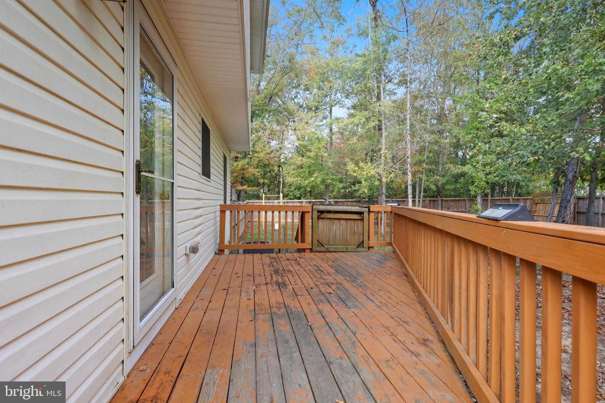 7168 Botha Road Bealeton, VA 22712 - Photo 21 of 23 Serene deck overlooking lush greenery.