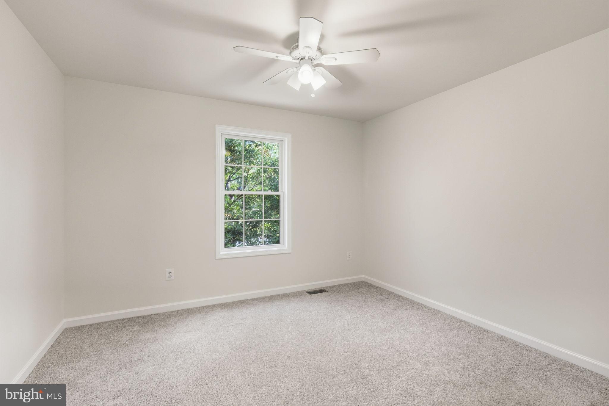 7168 Botha Road Bealeton, VA 22712 - Photo 26 of 36 an empty room with a window and a fan