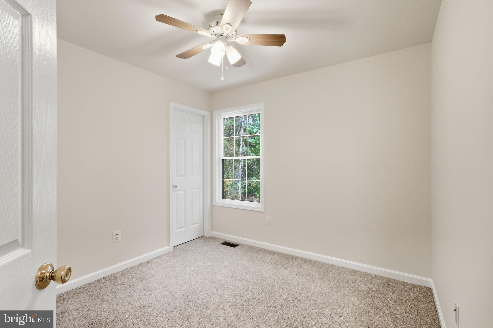 7168 Botha Road Bealeton, VA 22712 - Photo 28 of 36 an empty room with windows and fan