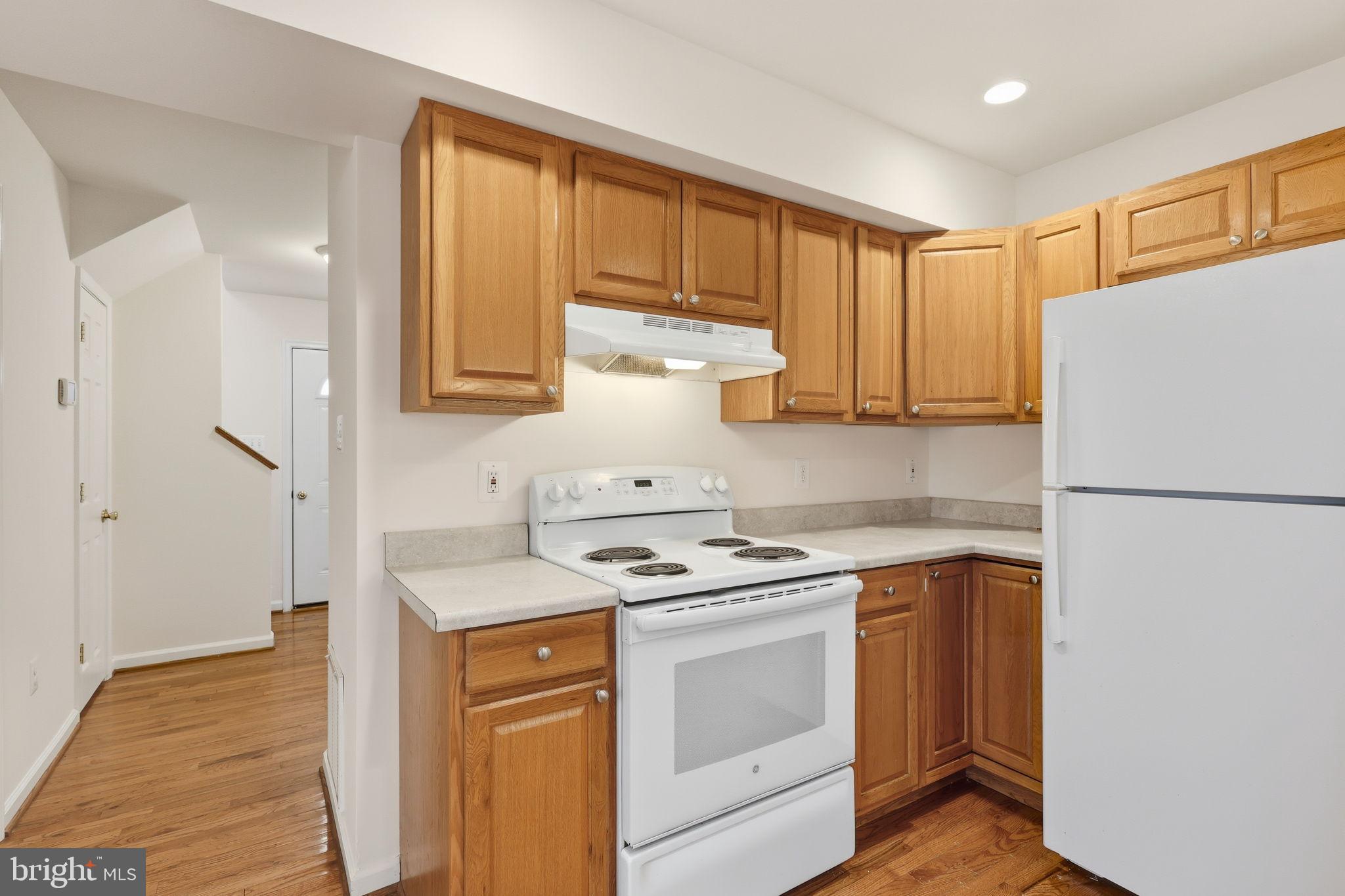 7168 Botha Road Bealeton, VA 22712 - Photo 6 of 23 Modern kitchen with warm wood cabinetry.