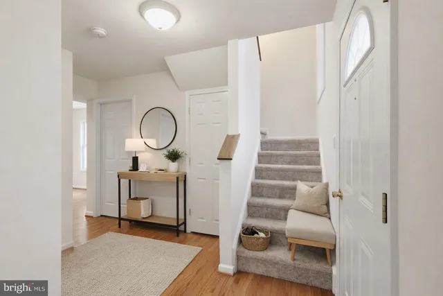 a view of living room with furniture and wooden floor