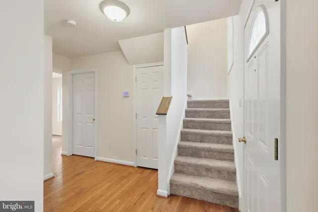 a view of an entryway with wooden floor