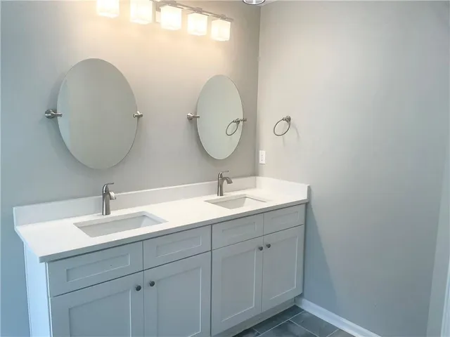 a bathroom with a bathtub and shower