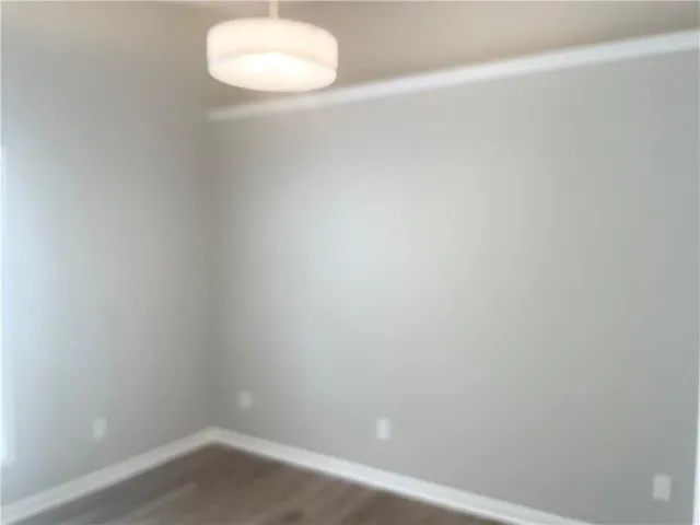 a bathroom with a white wall