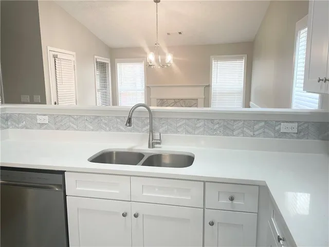 a bathroom with a sink and cabinets