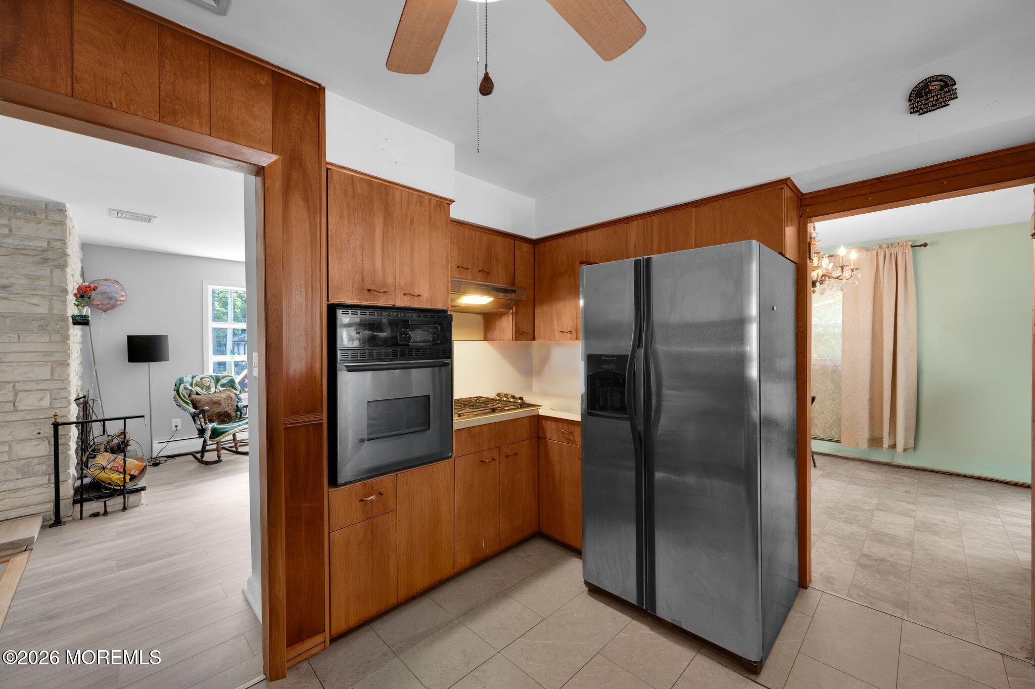 2604 Logan Road Asbury Park, NJ 07712 - Photo 9 of 39 a kitchen with stainless steel appliances a refrigerator and a stove