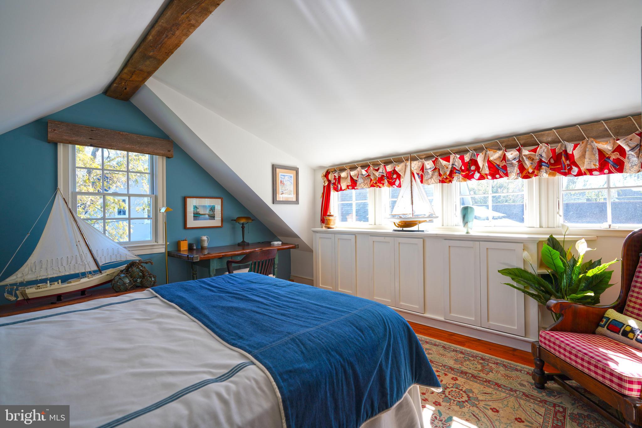 410 Pilottown Road Lewes, DE 19958 - Photo 62 of 114 a bed room with a bed and a potted plant