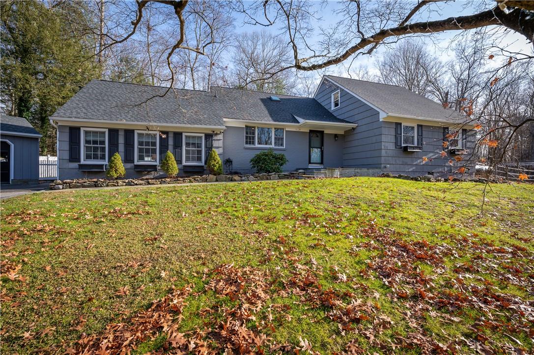 front view of a house with a yard