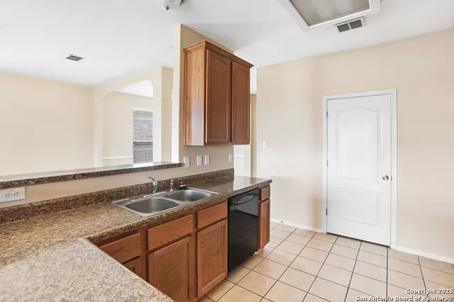 a bathroom with a sink a vanity and a mirror