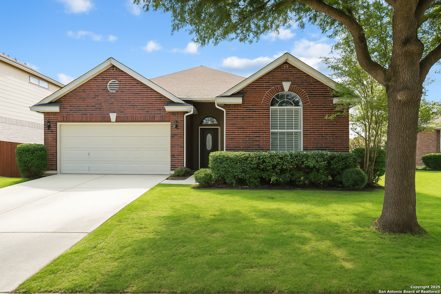 157 Crimson Tree Cibolo, TX 78108 - Photo 2 of 27 a front view of a house with garden