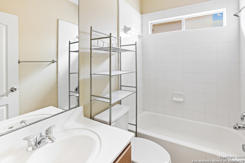 157 Crimson Tree Cibolo, TX 78108 - Photo 23 of 27 a bathroom with a bathtub and a shower