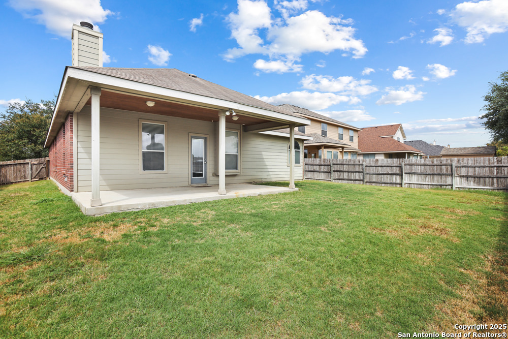 157 Crimson Tree Cibolo, TX 78108 - Photo 25 of 27 a view of a house with a backyard