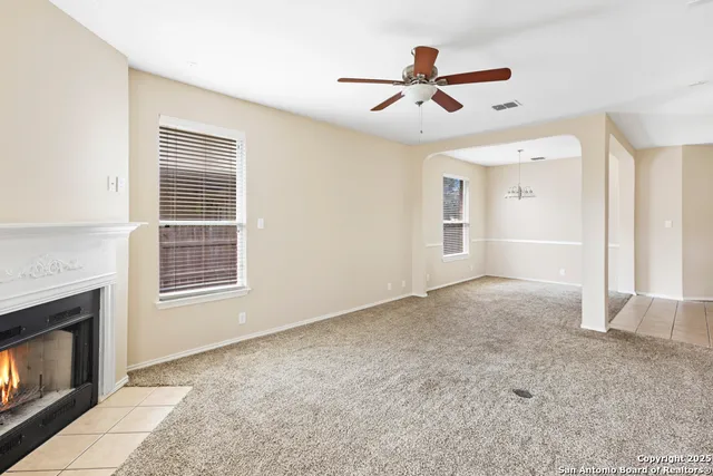 a view of livingroom with hardwood floor and a ceiling fan