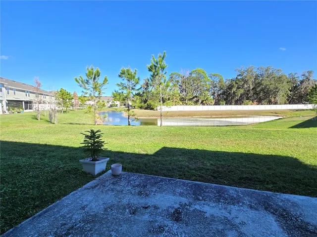 a view of a patio with swimming pool