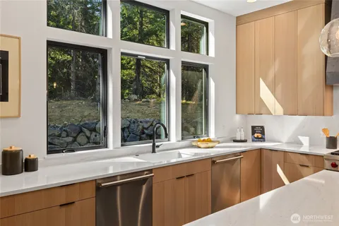 a kitchen with a sink and a window