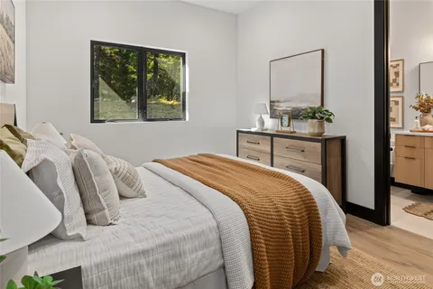 a bedroom with a bed and a dresser