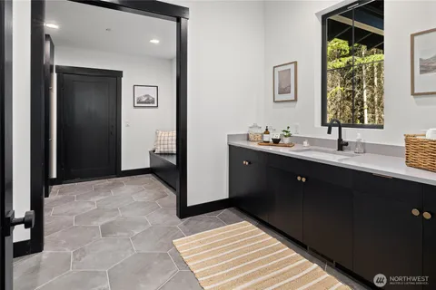 a bathroom with a sink and a mirror