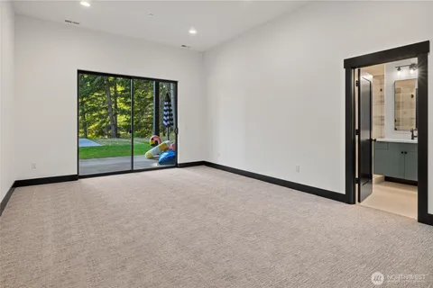 a bathroom with double sink and a mirror