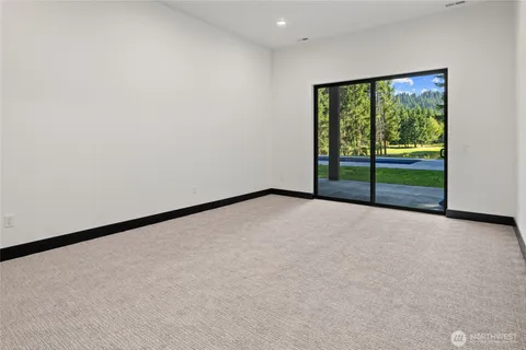 an empty room with furniture and a fireplace