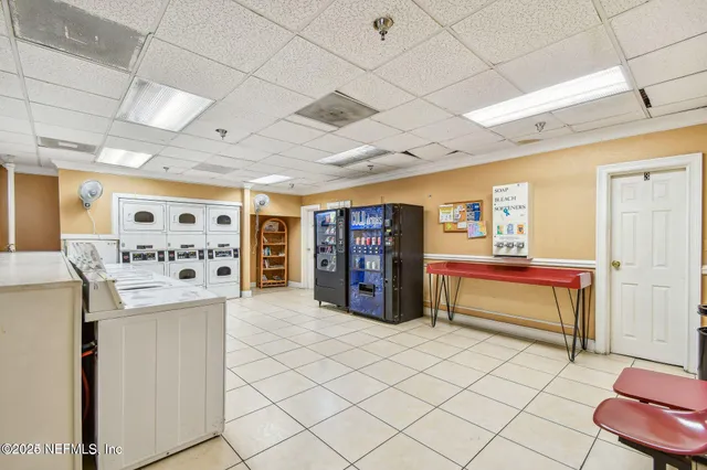 a view of a hallway with a chandelier