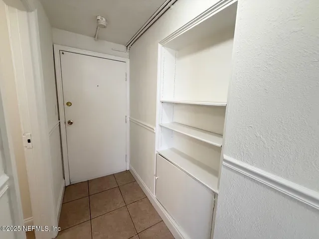 a view of an empty walk in closet