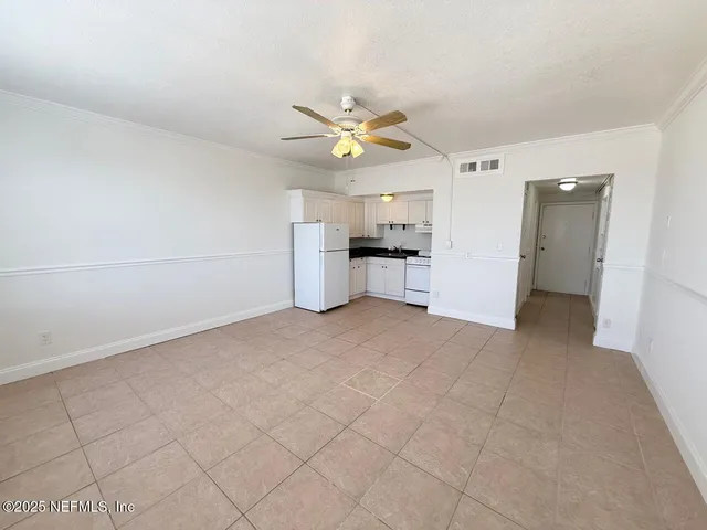 a view of a kitchen with microwave and a sink