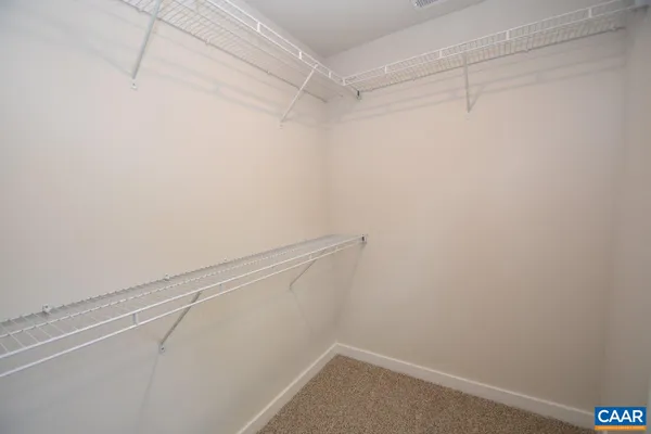 a view of a room with racks on the wall