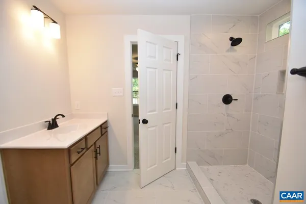 a bathroom with a sink and shower