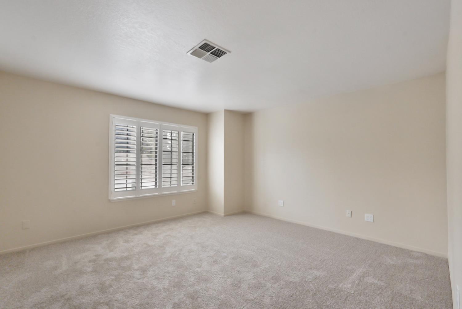 230 West Rumble Road, Unit B Modesto, CA 95350 - Photo 11 of 24 a view of an empty room with a window